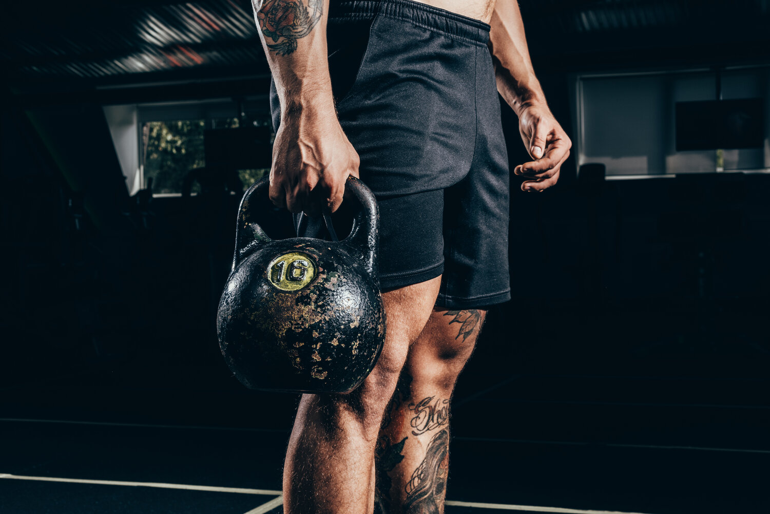 sportsman holding kettlebell